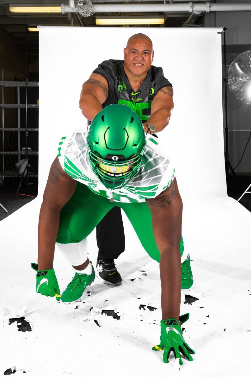 Mells with Defensive Line Coach Joe Salave'a on his Oregon official visit.